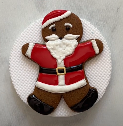 Image of Making Santa Cookies Using the Gingerbread Man Cookie Cutter