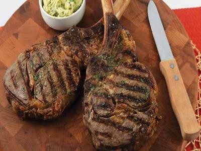 Image of Grilled Tomahawk Ribeye Steaks  with Classic Steak Butter
