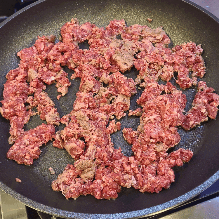 Image of Add ground buffalo meat and cook until browned, breaking it apart with a spatula as you go.