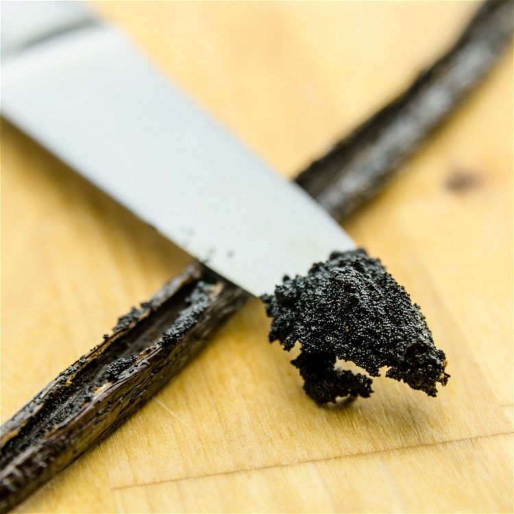 Image of Using a knife, split the Madagascar Vanilla Bean lengthwise and...