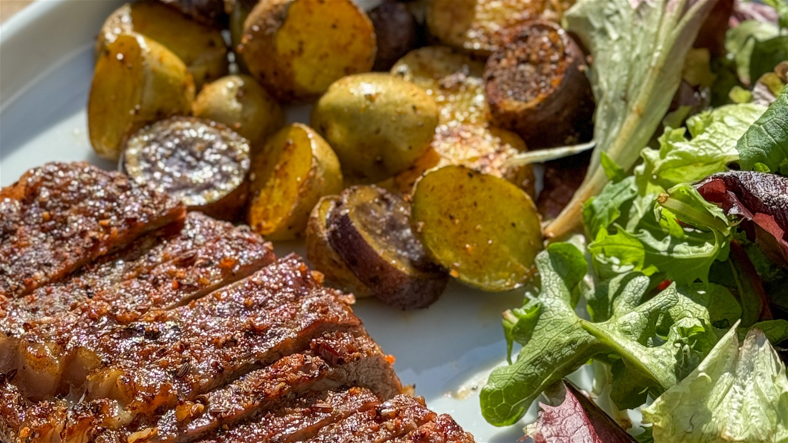 Image of New York Strip with Roasted Potatoes and Side Salad