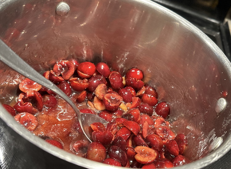 Image of Once thickened, add your cherries, turn the heat down, and simmer. Simmer until the cherries bubble and turn glossy. The time will vary depending on if you’re using fresh or frozen, but it should be around 5 minutes.