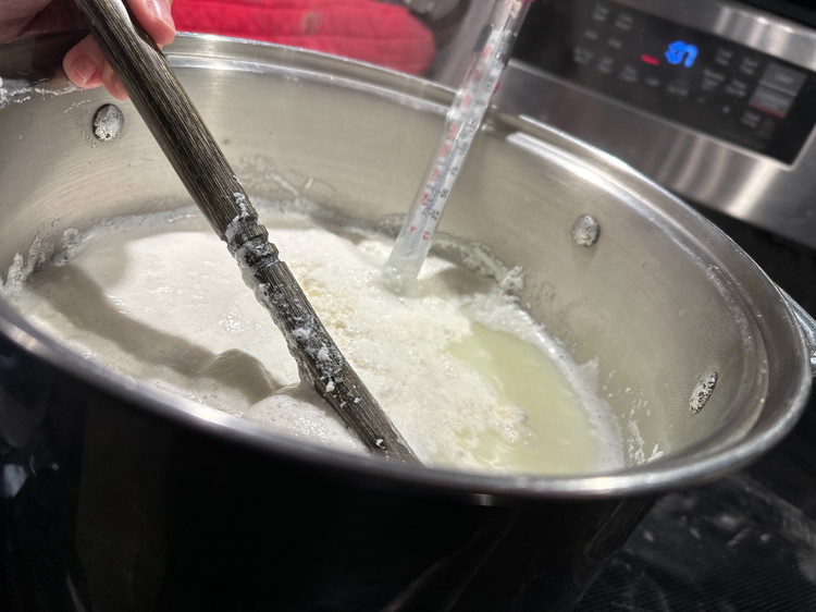 Image of Check your temperature often. When it gets over 150° F, that’s when the magic happens!  The milk will form foam on the top, and little lumps will form in the foam. Continue boiling until the curds are thick enough, they...