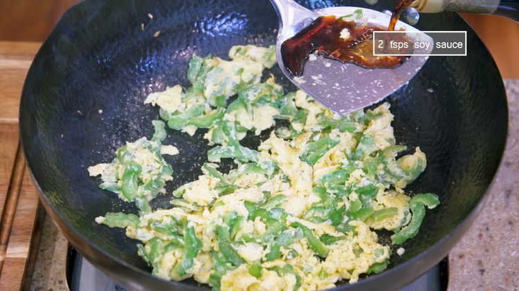 Image of Add ground white pepper and a drizzle of soy sauce from the side of the wok. You want to hear that sizzling sound, which means the soy sauce is caramelizing and creating some complex flavors. Stir well, and you are...