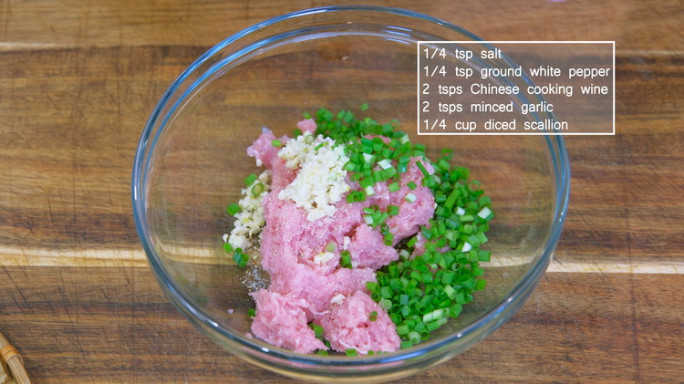Image of Season it with 1/4 tsp salt, 1/4 tsp ground white pepper, 2 tsps Chinese cooking wine, 2 tsps minced garlic, and 1/4 cup diced scallions. Mix until the seasonings are well combined. Then stir the meat in one direction for...