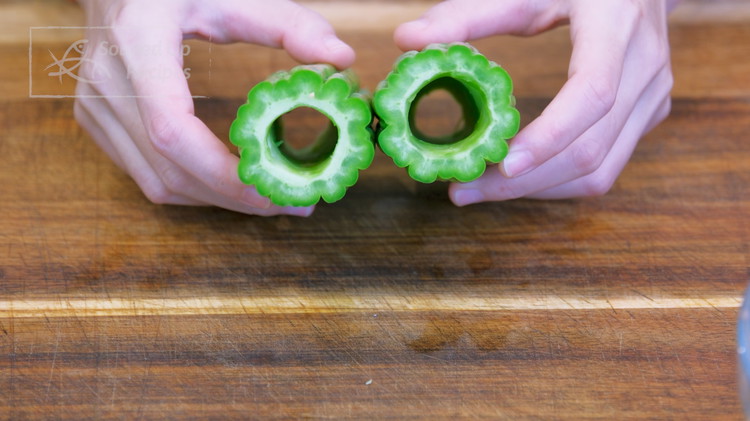 Image of Discard both ends from the bitter melon then cut it in halve into 2 cylinders. Stick a dinning knife into the center to carefully remove the white sponge parts, and you have these beautiful bitter melon tubes.