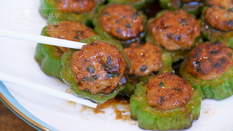 Image of Place the stuffed bitter melon on a serving plate and drizzle the sauce all over. If you serve it as a main dish, it is enough for one person. But as an appetizer, it is enough for 2-3 people to...