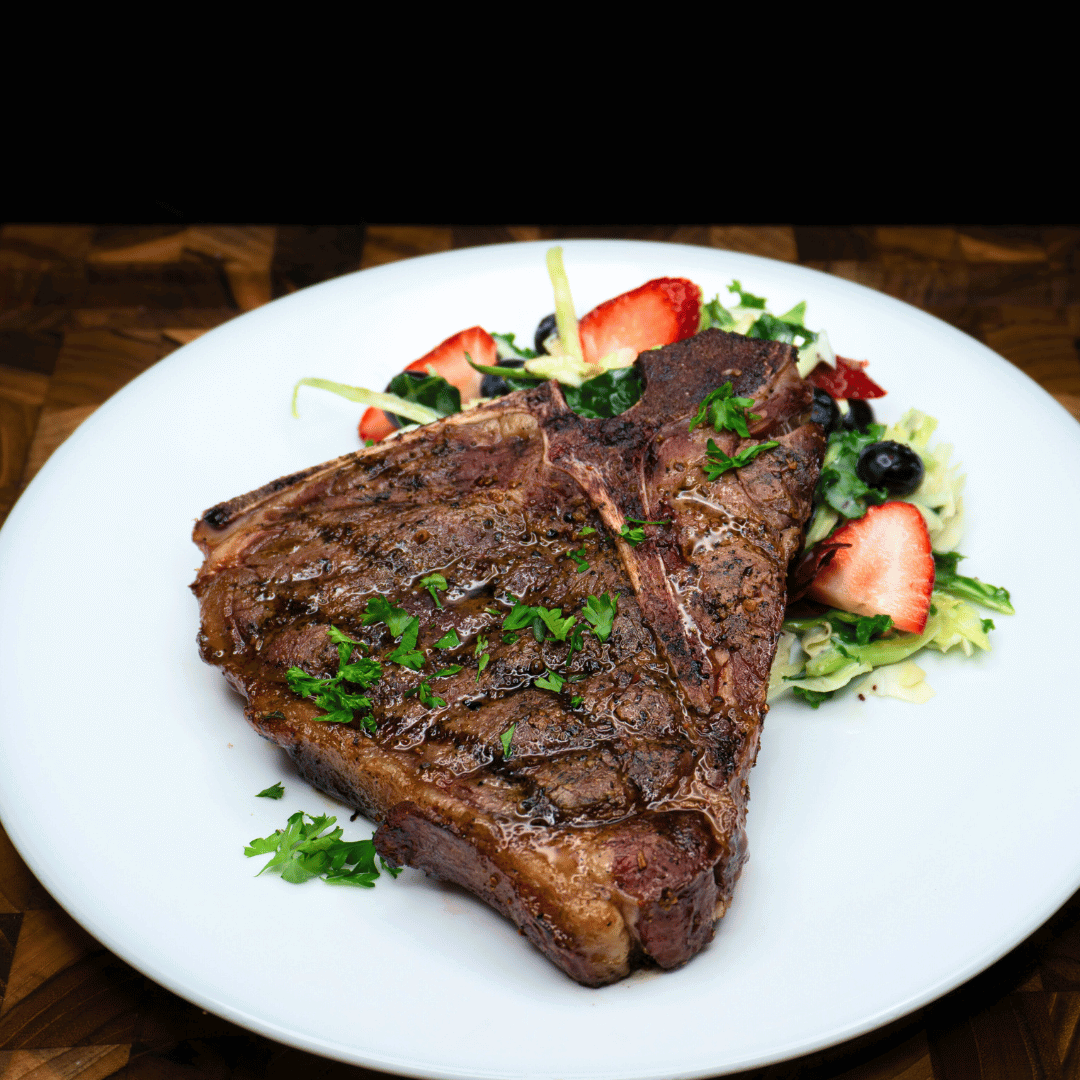Grilled Bison T-Bone Steak with Caramelized Onions