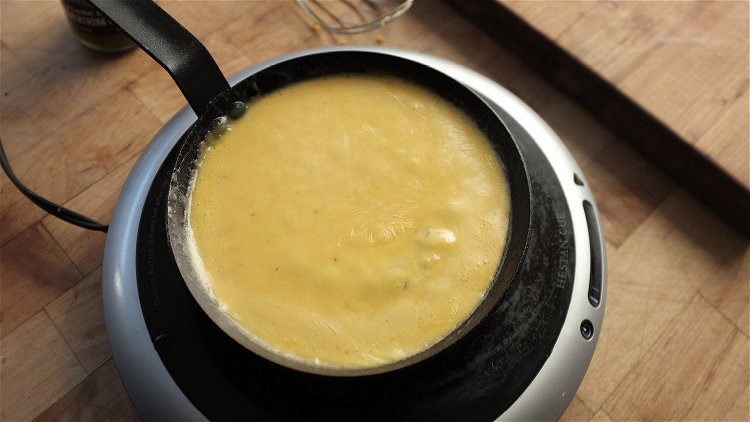 Image of While the nachos are browning, make the cheese sauce. Bring...