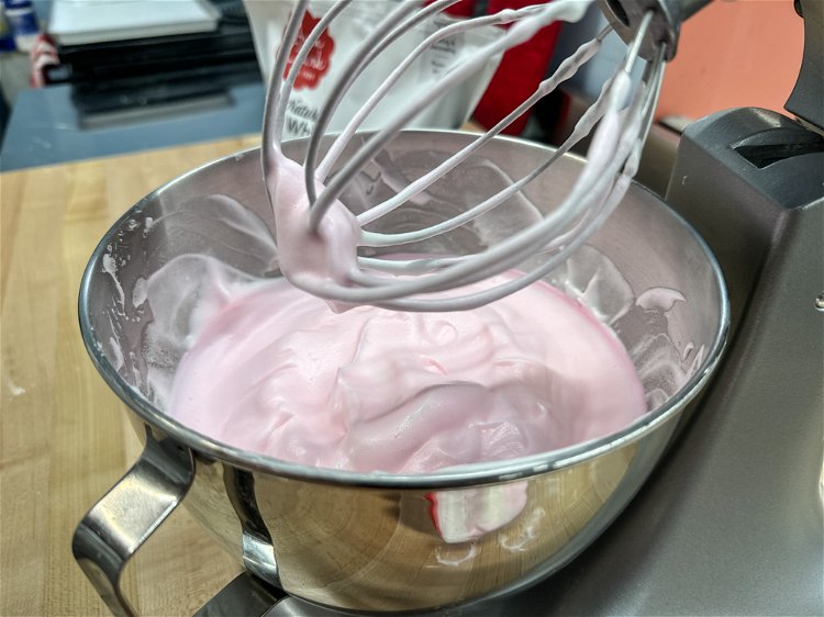 Image of The egg mixture should stand on its own at this point—when the whisk is lifted, the peaks in the bowl should remain stiff.