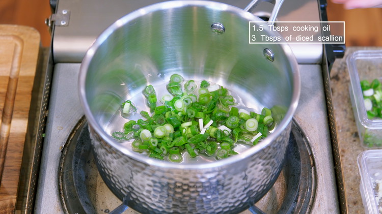 Image of Add oil and diced scallion to a saucepan and stir over medium-low heat for 2 minutes or until the scallion is slightly golden on edge.