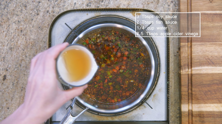 Image of Add soy sauce, fish sauce, apple cider vinegar, and water. Continue to stir for a minute and turn off the heat.