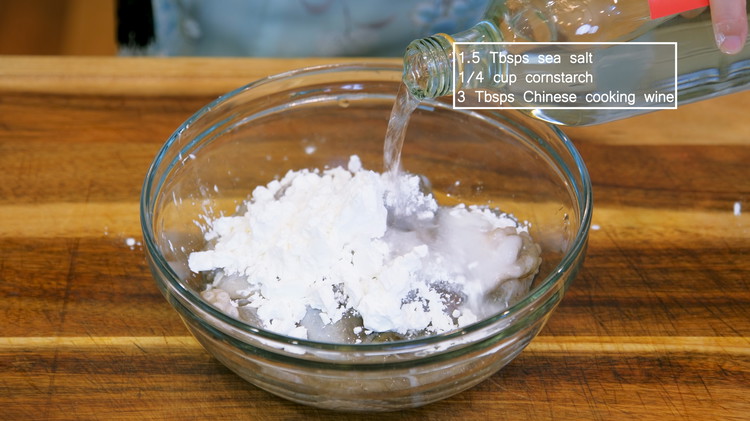 Image of To wash the octopus, add sea salt, cornstarch, and Chinese cooking wine. Rub for 3-5 minutes. The salt will act like sand and scrub off any mucus from the octopus. The cornstarch and cooking wine will help to remove the...
