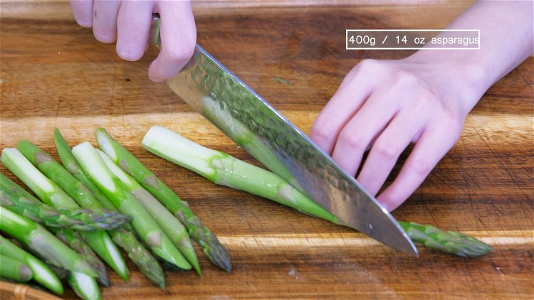 Image of Use a vegetable peeler to peel the stringy and fibrous...