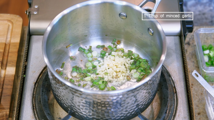 Image of Add minced garlic and keep stirring over medium-low heat until the garlic is slightly golden. Don’t burn it; otherwise, it will bring a bitter taste.