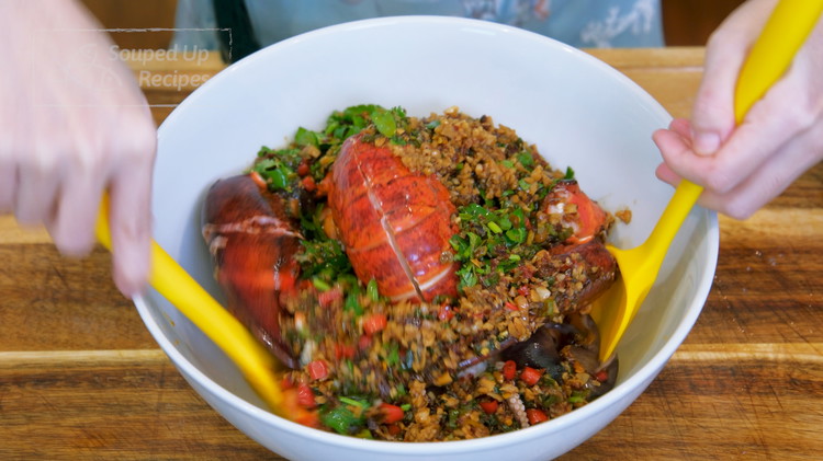 Image of Add all the seafood into a big mixing bowl and pour in the spicy dressing. Toss thoroughly. You don’t need to mix the lobster’s head in the dressing because we will just add it to the dish for presentation.