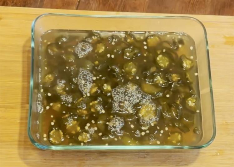Image of Remove the bag from the sous vide and let cool. Open the bag and pour into a large sealable food safe container and store in the fridge. Will last for up to 2 months. Jalapenos will mellow as time goes...