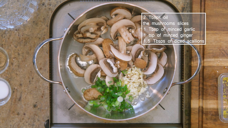 Image of Place a stock pot over a medium-heat stove. Add 2 Tbsps of oil, the mushroom slices, 1 Tbsp of minced garlic, 1 tsp of minced ginger, and 1.5 Tbsp of diced scallions. Stir for 2 minutes.