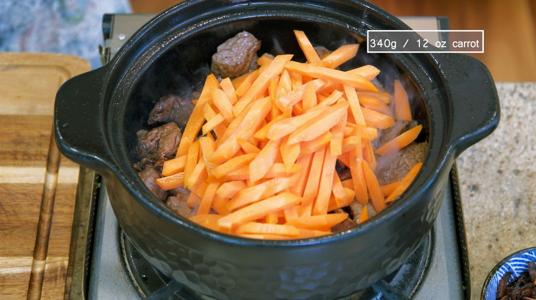 Image of Add the carrot sticks and keep mixing over high heat for 3 minutes or until the carrots are slightly soft.