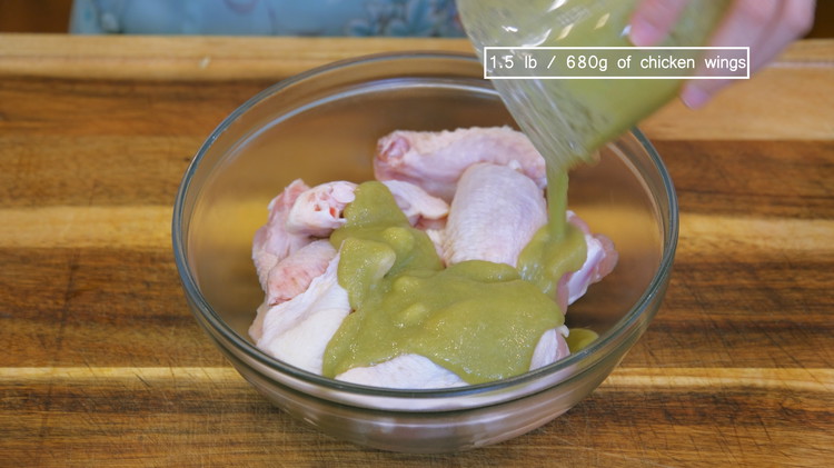 Image of Combine the puree and the chicken wings in a large mixing bowl and mix thoroughly. Cover it and let it rest in the fridge for 1 hour.
