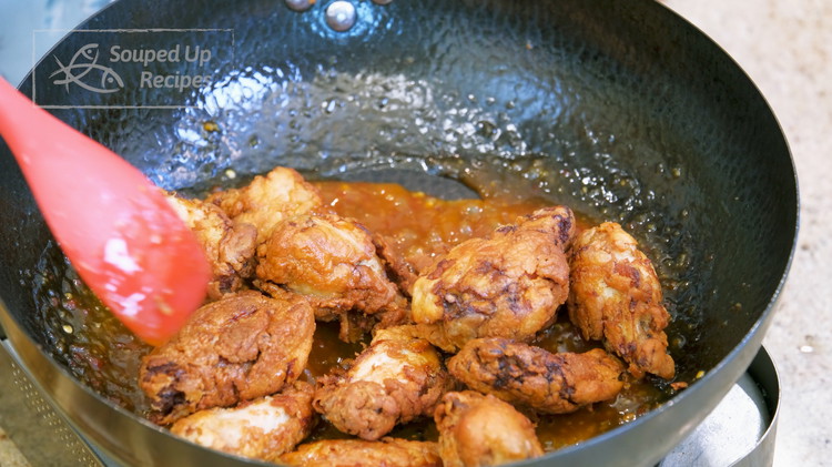 Image of Thoroughly shake the lemon sauce to lose the starch. Pour it into the wok and stir over medium-low heat for 2-3 minutes. When you see the liquid is thickened, introduce the chicken wings back into the wok. Toss everything until...