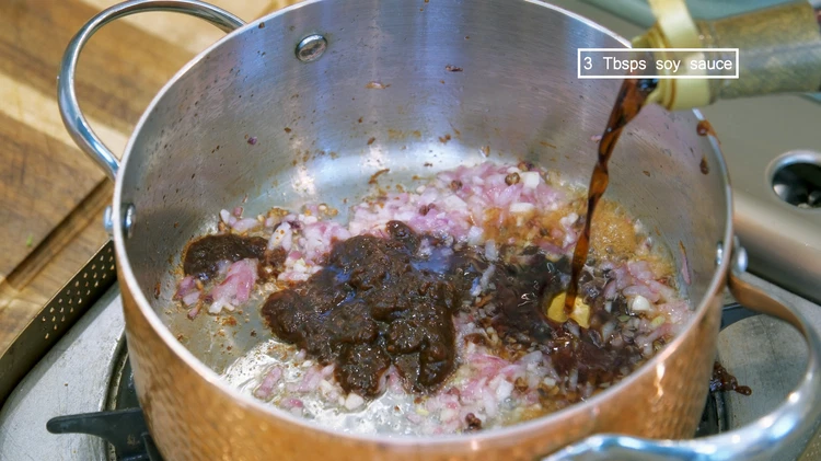 Image of Add soybean paste and soy sauce. Keep stirring for a minute.
