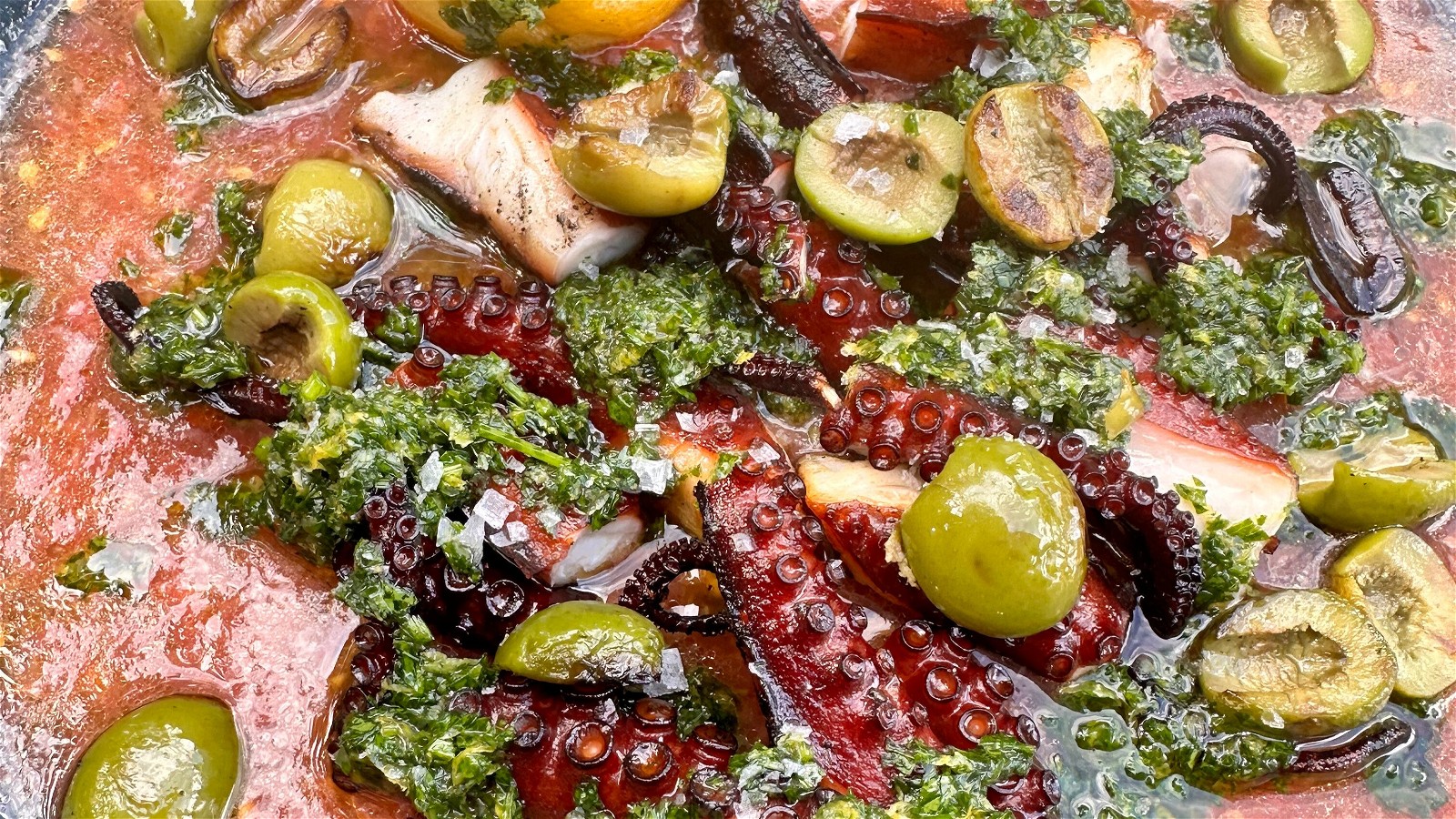 Image of Smoked and Grilled Spanish Octopus with Olives and Tomates