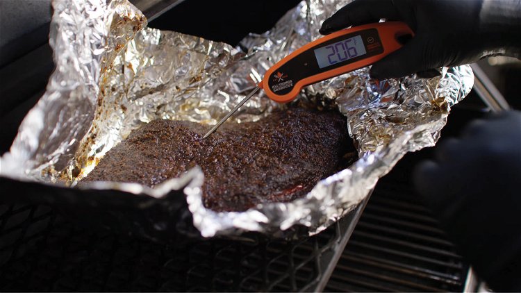Image of Place the brisket on top of two sheets of heavy...