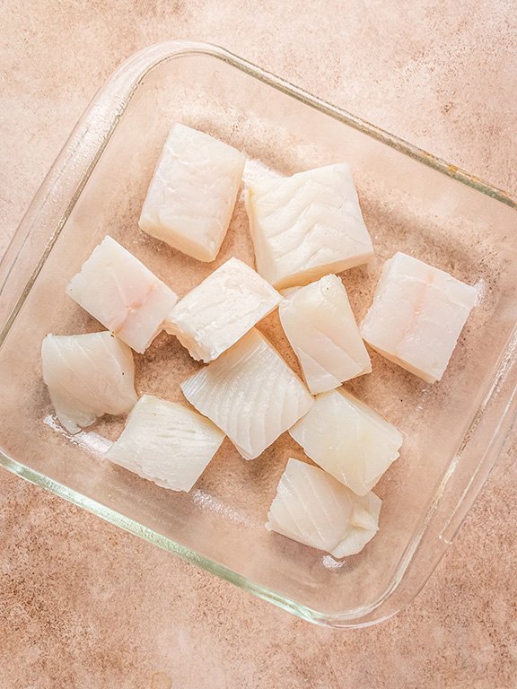 Image of Arrange halibut in dish.