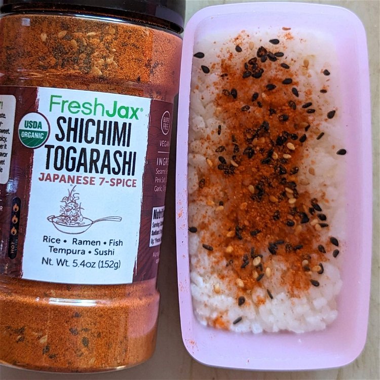 Image of Using a musubi mold (or the empty SPAM can), place...
