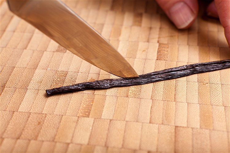 Image of Split the vanilla beans in half to expose the seeds....