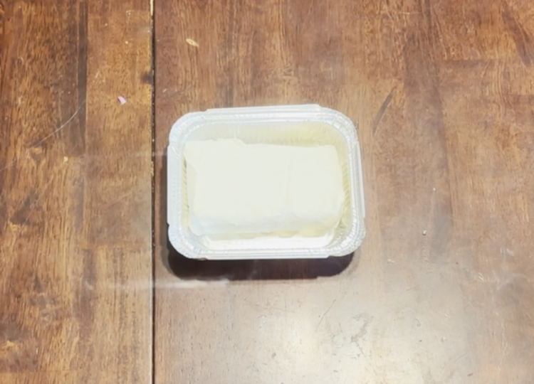 Image of Place cream cheese in a small pan for use on your smoker