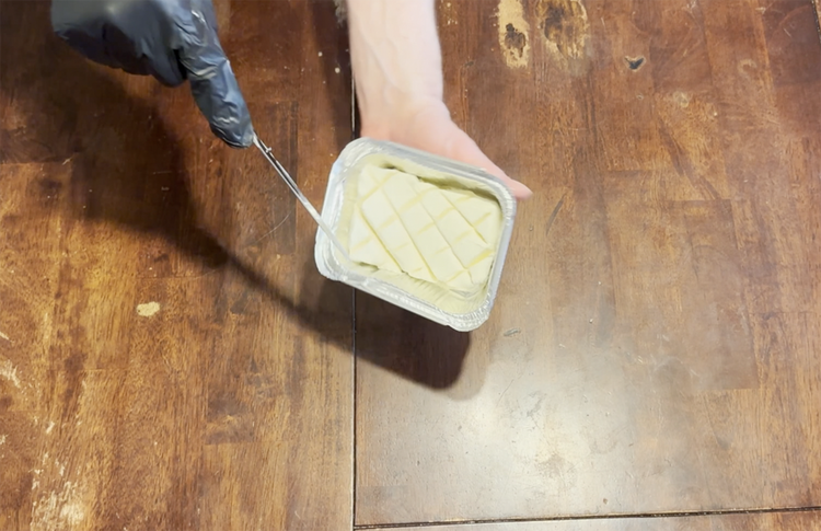 Image of Use a butter knife and start to create slices about a ¼ inch apart at an angle in the cream cheese. Only cut in about half way down (do not cut all the way to the bottom). Once done, slice...