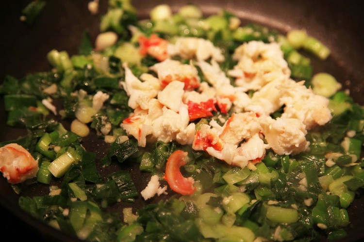Image of Add the crab just before you pull it and fold in for about a minute until everything is hot.