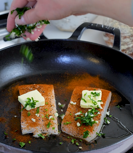 Image of Place the halibut fillets in an oven-safe skillet or a...