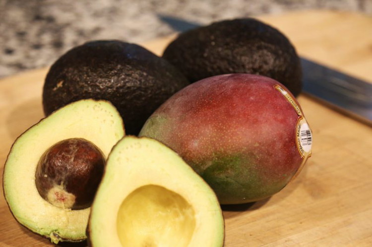 Image of Halve the avocados and remove the pits.