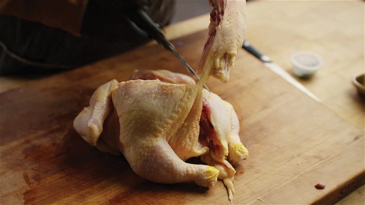 Image of Spatchcock a whole chicken, then divide the chicken in half,...