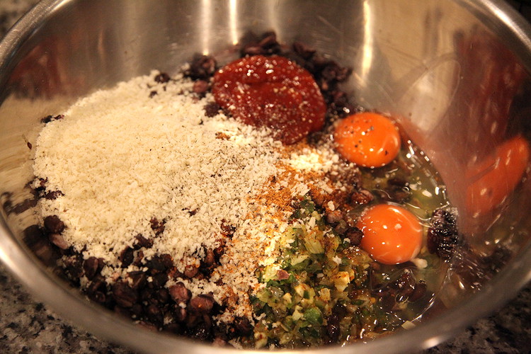 Image of To the mashed beans add: All the sautéed veggies, 1 tbsp Worcestershire Sauce, 1 tbsp Ketchup, 1.5 tbsp Powerful Pepper Taco Mix, 1 tbsp Chipotle Powder, 1 tsp Powerful Pepper Smoked Arbol Chili Flakes, 2 large eggs, ½ cup Panko...