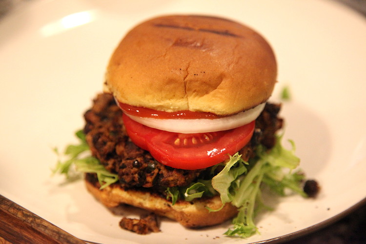 Image of Add bun, mayo, lettuce, burger, tomato, onion, ketchup and then the top bun.
