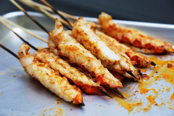 Image of Once they hit an internal temp of 130 or are opaque throughout you can take them off the grill and take them back to the cutting board. Cut each tail in half down the middle of the seam for your...