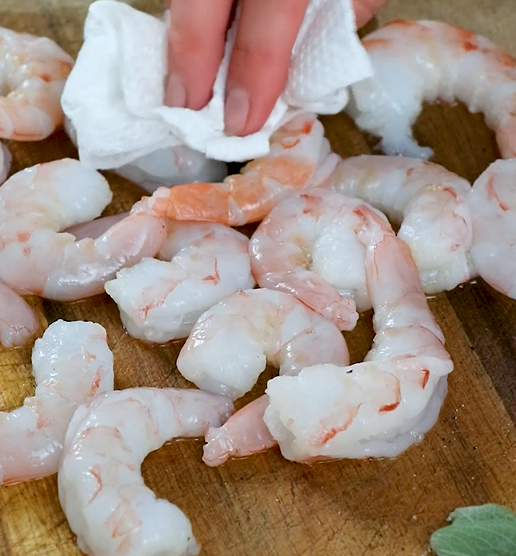 Image of Thaw Sizzlefish Shrimp in the fridge overnight. Pat the shrimp...