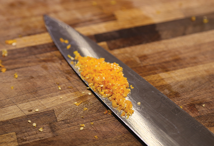Image of In a good blender spin up the tomatoes, strained tomatoes, garlic, onion, stock, and pepper sauce (or chili peppers) until well blended. (But not the Chili Oil if you are using that)