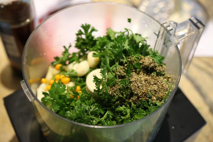 Image of Place the parsley, garlic, peppers, salt, and pepper in a food processor and process until it’s nice and fine, scraping the bowl as necessary. This can be done by hand… If you do, I hope you have strong arms, keep...
