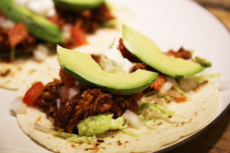 Image of I served this recipe as tacos on this occasion with the avocado and sour cream playing counterpoint to the heat in the chicken.