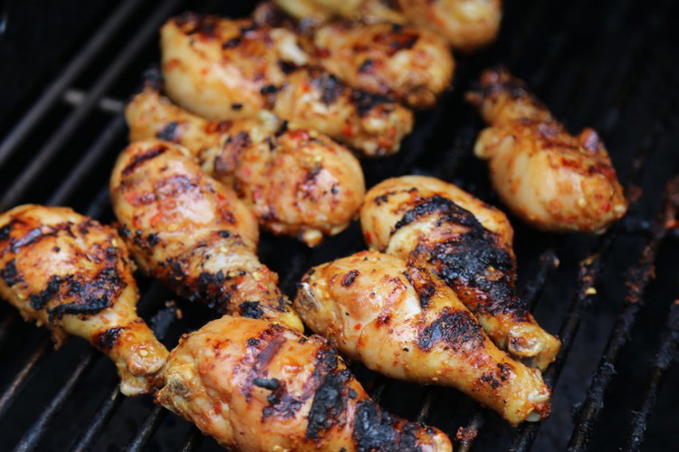 Image of Grill over medium heat for ~20-30 minutes (or until internal temperature of 160 close to the bone), rotating and brushing with extra marinade as you go.