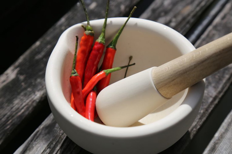 Image of Slice a shallot bulb into rounds about 1/8 inch thick and make rings. shake some fish sauce over the rings and toss to coat. Dredge the shallot rings in some corn starch and fry in the wok in batches with...