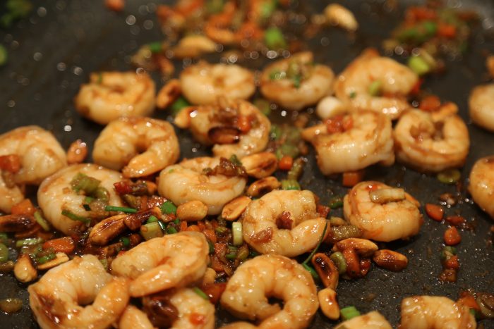 Image of Add in the shrimp, garlic and ginger and cook 5 minutes stirring often.