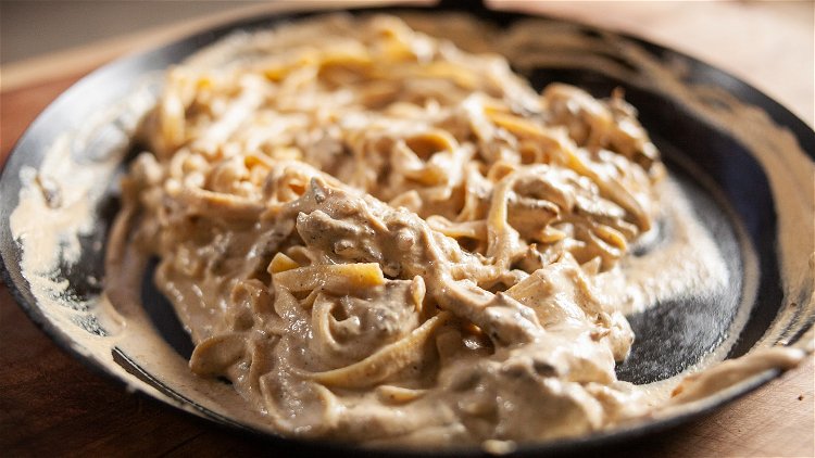 Image of Add the alfredo sauce to the dutch oven. Stir and...