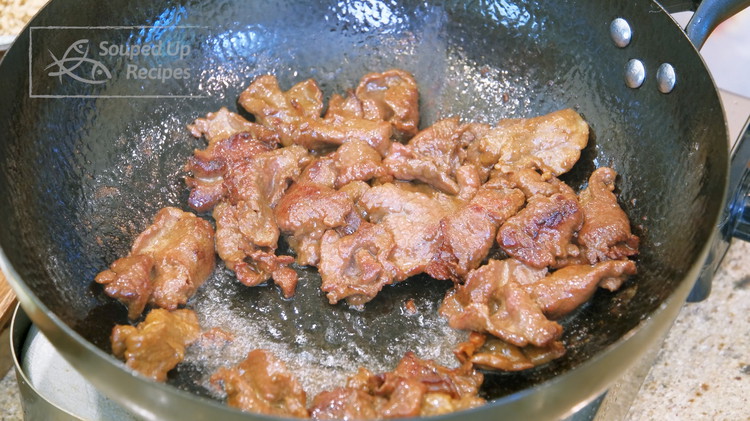 Image of Turn the heat to high and heat the wok until smoking hot. Add oil and swirl the oil around to create a non-stick later at the bottom. Add the marinaded beef and let it stir for 2 minutes or until...