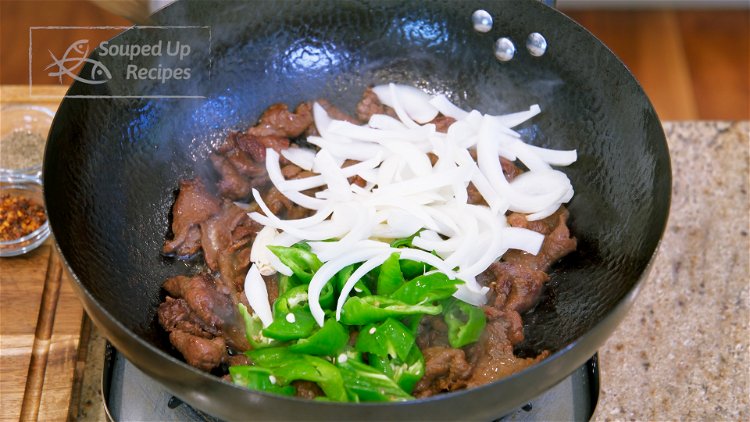 Image of Add the onion, chili pepper, and garlic. Stir for 1.5...